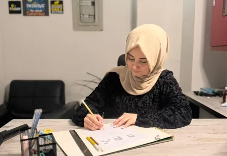 A designer sketching ideas at her desk